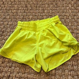 Neon yellow lululemon low rise 4 inch hotty hots